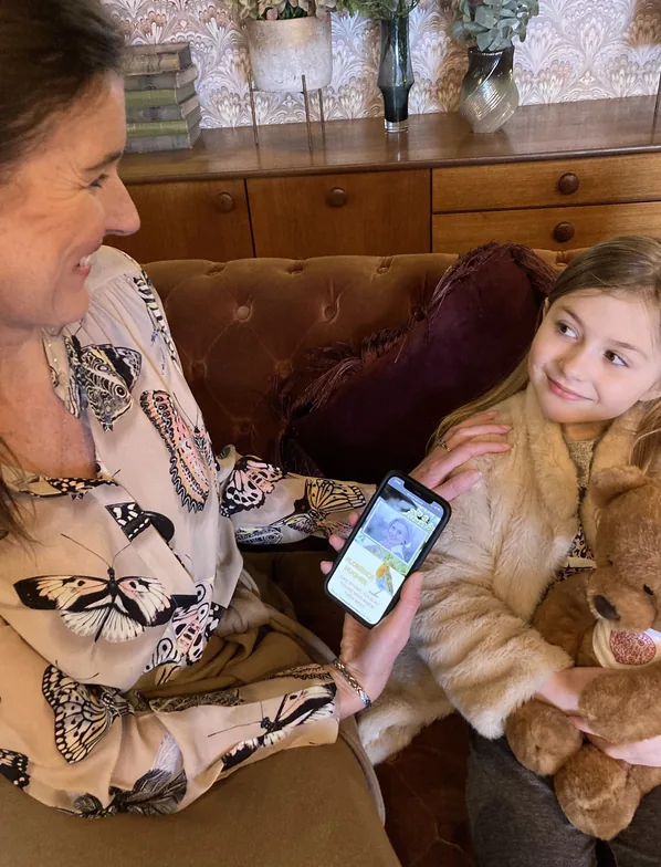 Child holding an eMemorybear