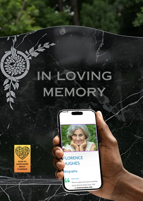 Black headstone reading In Loving Memory, with a phone held up showing Florence Hughes's memorial page